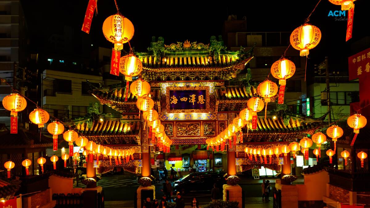 Lanterns arranged on strings light a city square. File picture.