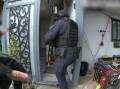 Police raiding a Queensland property to dismantle a multi-million-dollar drug trafficking syndicate. Picture by Queensland Police
