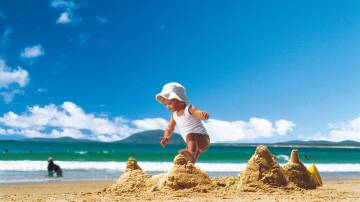 Child plays on Mooloolaba Beach, Queensland. The area has seen massive growth as city dwellers seek a seachange. Picture Tourism Queensland