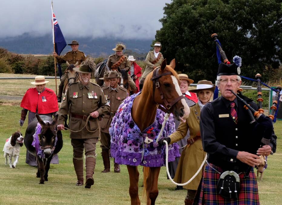 Members of the Northern Tasmania Light Horse Troop marching with service animals. Picture supplied