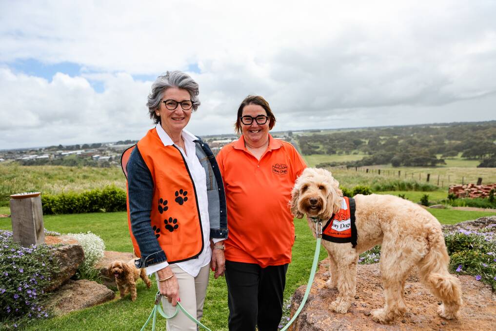 Deb Jones and Susie Alexander with Sadie the labradoodle. Picture by Anthony Brady