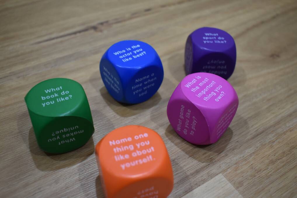 These dice are used as conversation starters.