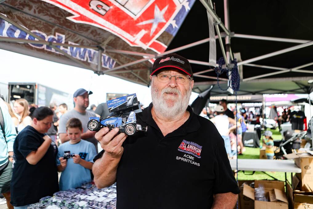South Australian man David Grose holds a diecast model of a sprintcar.