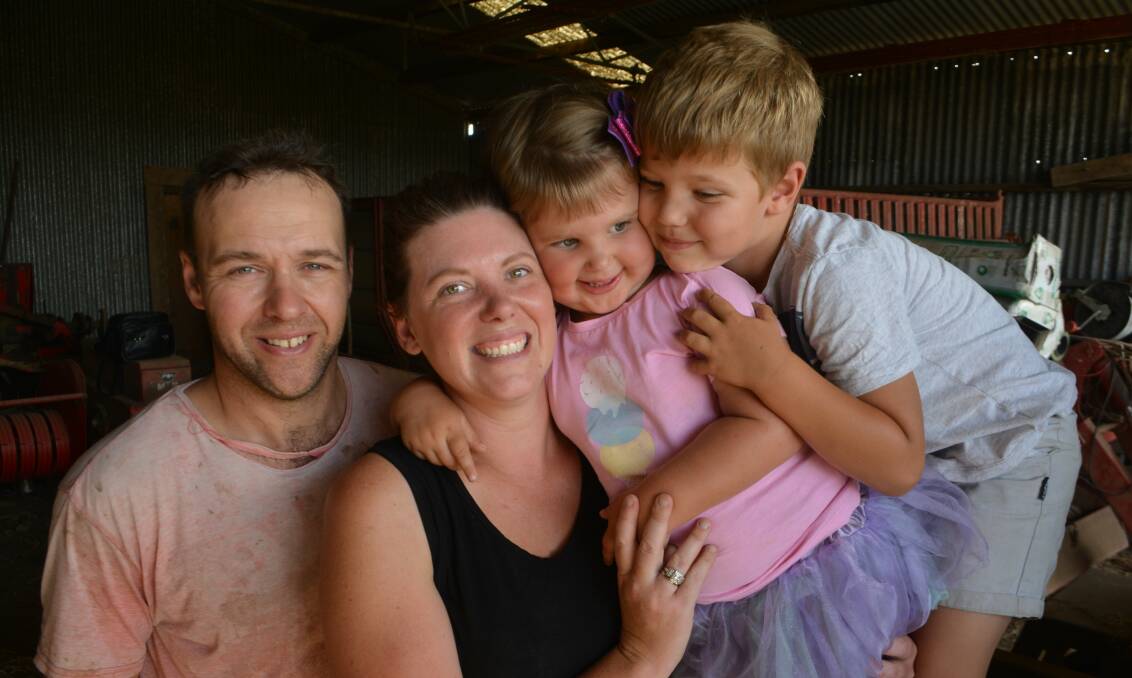 Aiming to contribute: Scholarship recipient and dairy farmer Lauren Peterson with partner Tony Hassett and children Paddy and Audrey at their Naroghid farm near Camperdown.