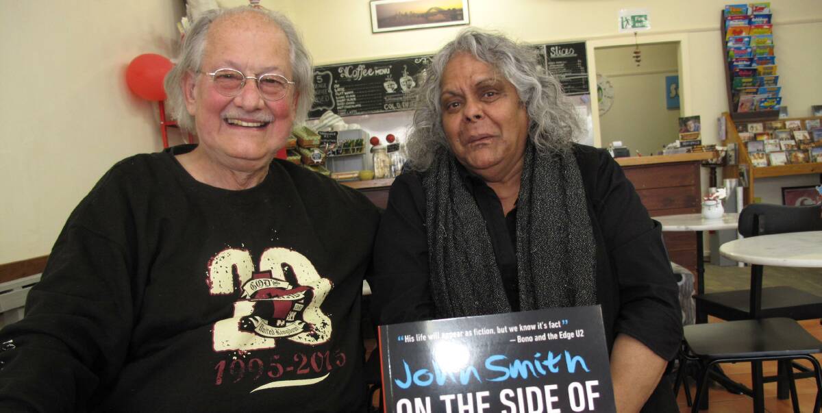 Still on the road: God's Squad founder Reverend John Smith with Libby Clarke in Warrnambool where he promoted the reprint of his book. Picture: Everard Himmelreich