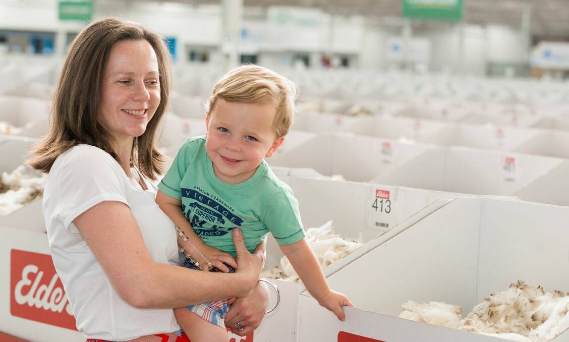 Wool enthusiast: Former Minhamite woman Claire Hausler, pictured with her son Jack at a wool sale, has created a woollen swaddling bag for infants.