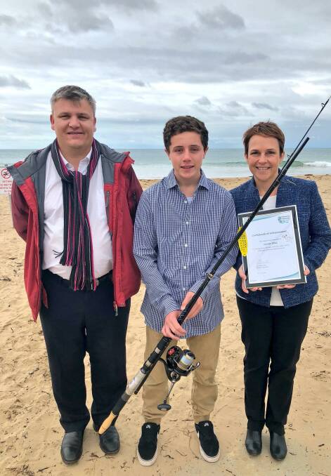Good idea: Xavier Ellul, centre, receives a certificate of appreciation from Jaala Pulford and Labor candidate for South Barwon Darren Cheeseman.
