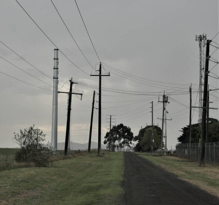 Causing concern: One of the poles, left, for the transmission line from the Salt Creek wind farm that runs from near Mortlake to Terang. 