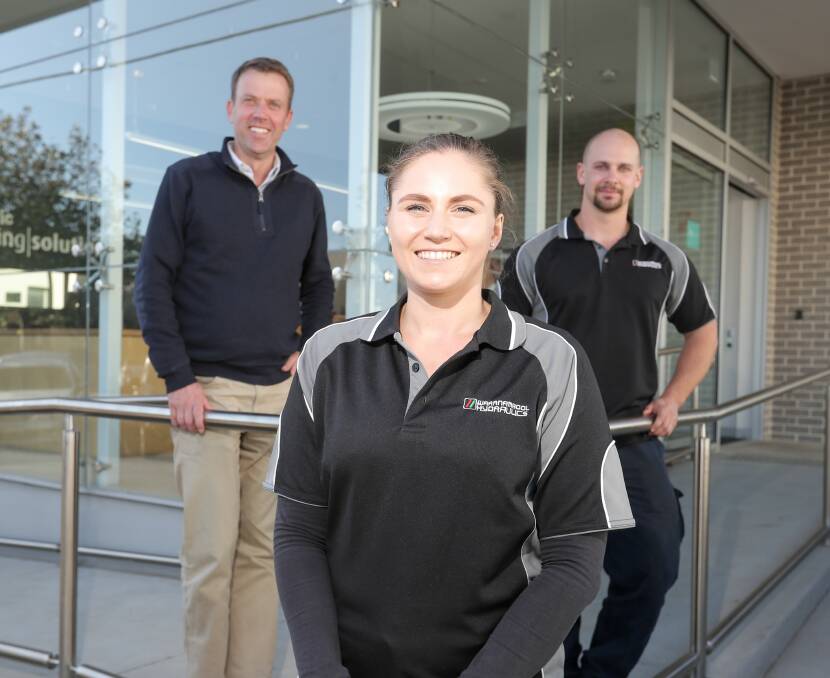 Working: Trainee Danielle Edge with Member for Wannon Dan Tehan, left, and Chris Errey of Warrnambool Hydraulics is one of the thousands of young people to find work  in Wannon.