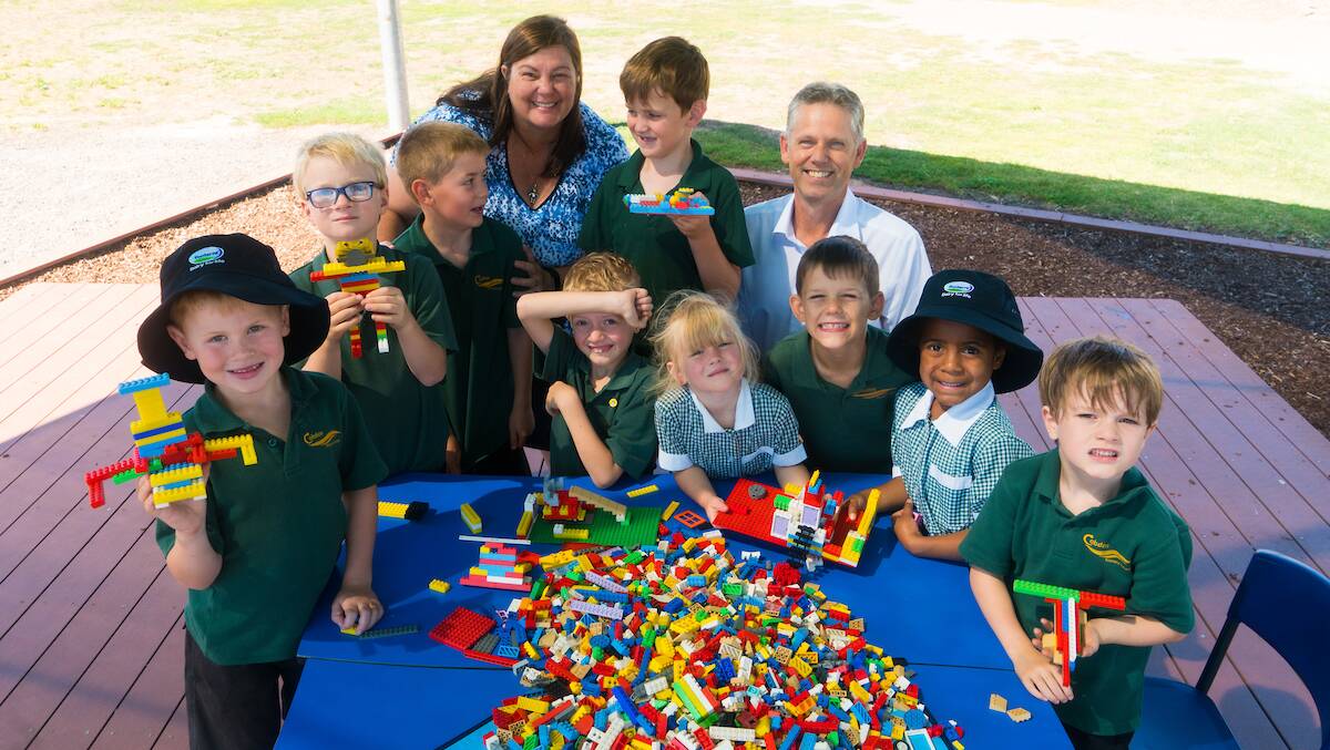 Building together: Cobden Primary School pupils and staff with Lego pieces bought with money from the Fonterra Grass Roots Fund.