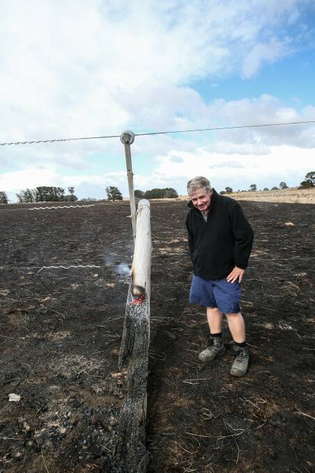 Flashback: Farmer Jack Kenna, of The Sisters, with a power pole that snapped and started a fire on his property on March 17 last year.