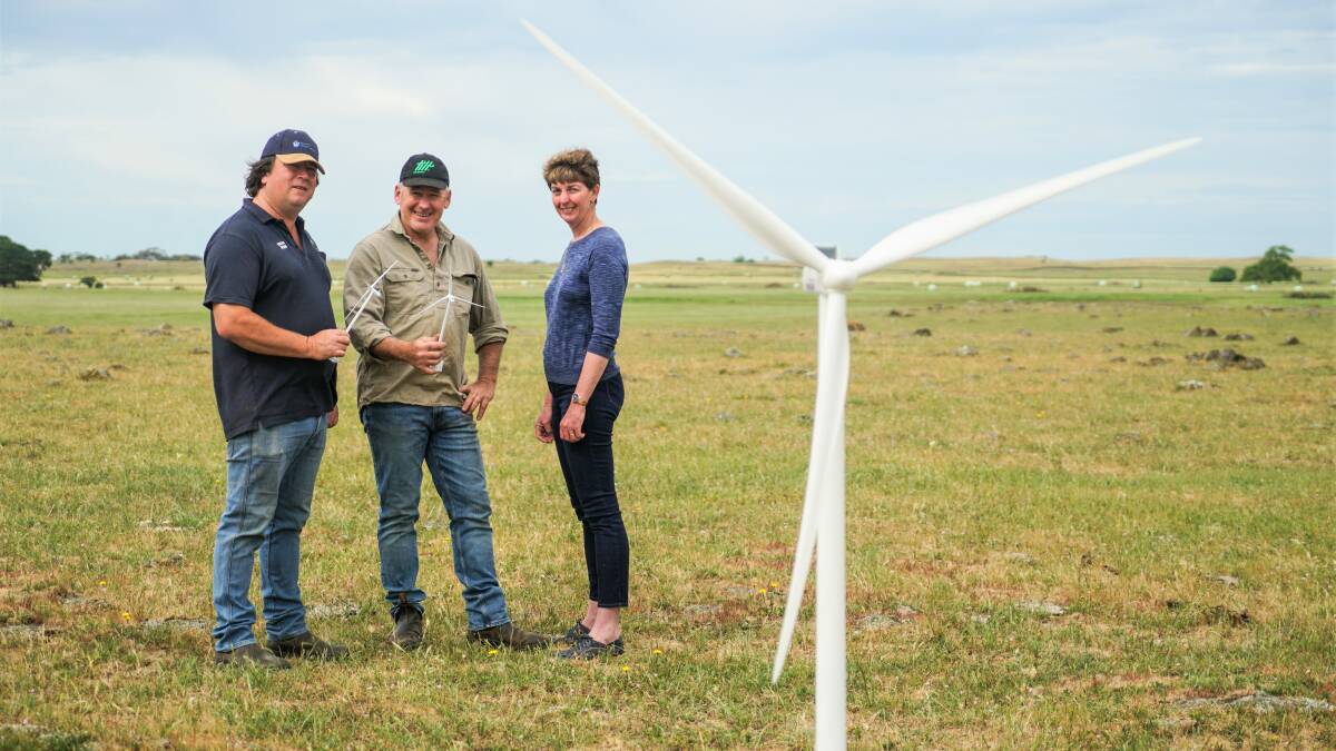 From little things, big things grow: Dundonnell landholders Will Lynch, Vin Gedye and Susan Kosch with miniatures of the wind turbines that will be erected on their land. 