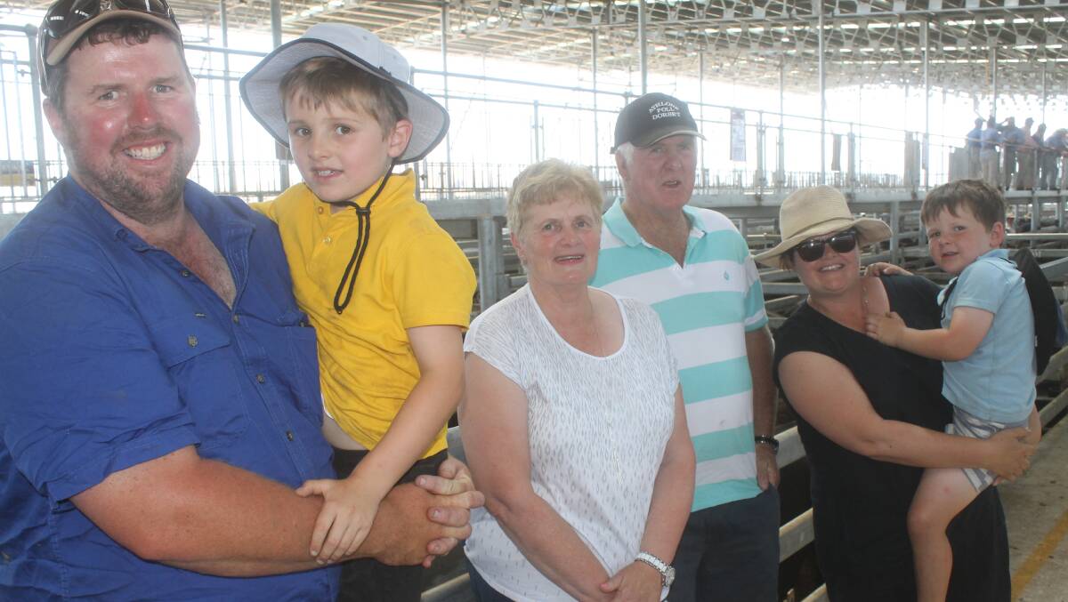 Family day: Hugh (centre) and Karen Cameron, with son Damien (left), his wife Lucy and boys Ben and Duncan at the Mortlake weaner sale.