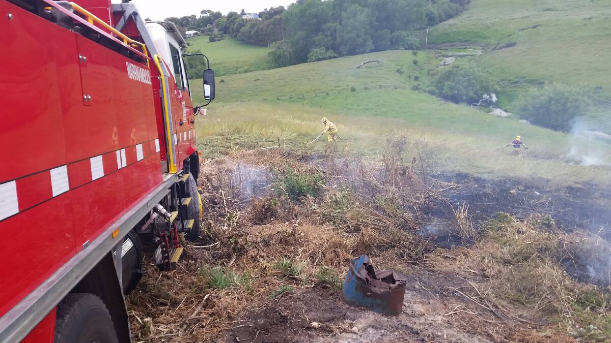 Firefighters attack the grass fire at Bushfield on Wednesday. 