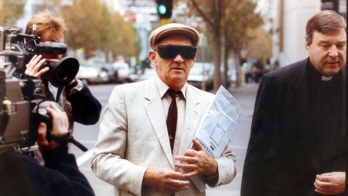  Gerald Ridsdale outside court, supported by George Pell, in 1993.