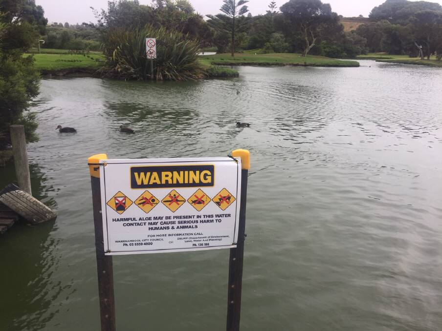 KEEP OUT: Signs at Lake Pertobe Adventure Playground warning people not to go near the water. The sign says harmful algae may be present in the lake water and contact could cause serious harm to humans and animals. 