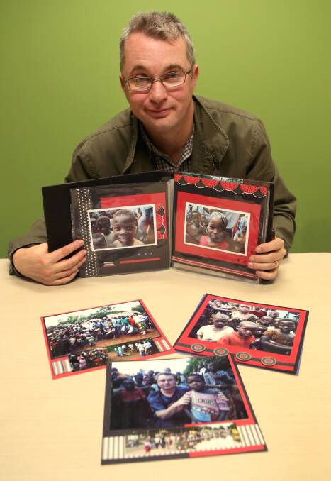 SELFLESS: Warrnambool City Council election candidate Troy Tampion with a collection of photos from his time in Africa. Picture: Amy Paton 