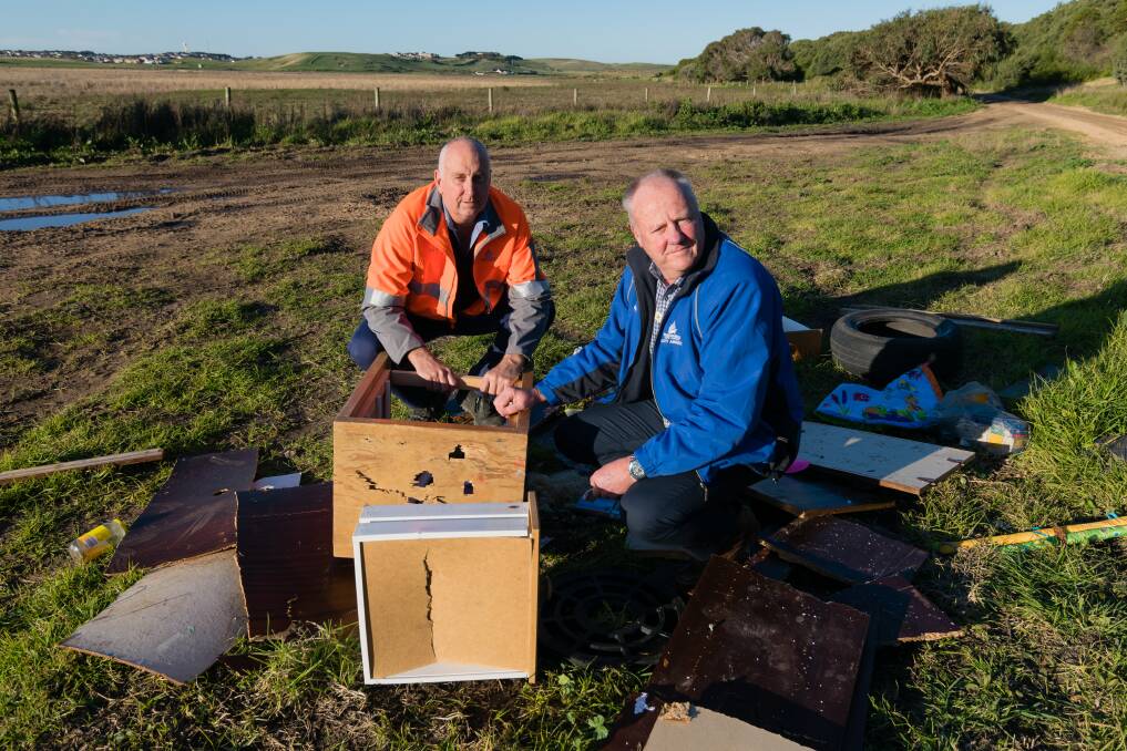 Warrnambool City Council's roads and drainage team leader Gary Shawyer and local laws coordinator Peter McArdle at Levys Point, where rubbish has been dumped. 
