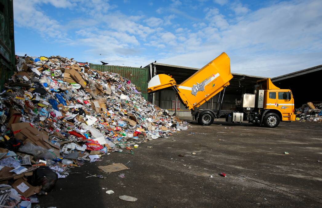 A LARGE PILE: A recycling truck adds to a 150 tonne pile of recycling material, which is equivalent to one week worth of collection in Warrnambool. Picture: Rob Gunstone