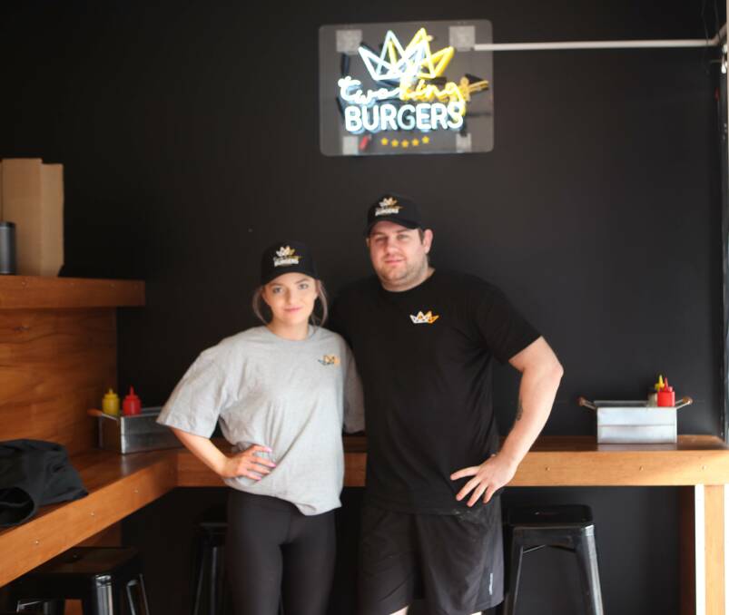 BUSY: Two Kings Burgers employee Lacey Moore and owner Travis Owen at the Liebig Street premises. The burger bar has set up a mobile phone app for customers to order from.    