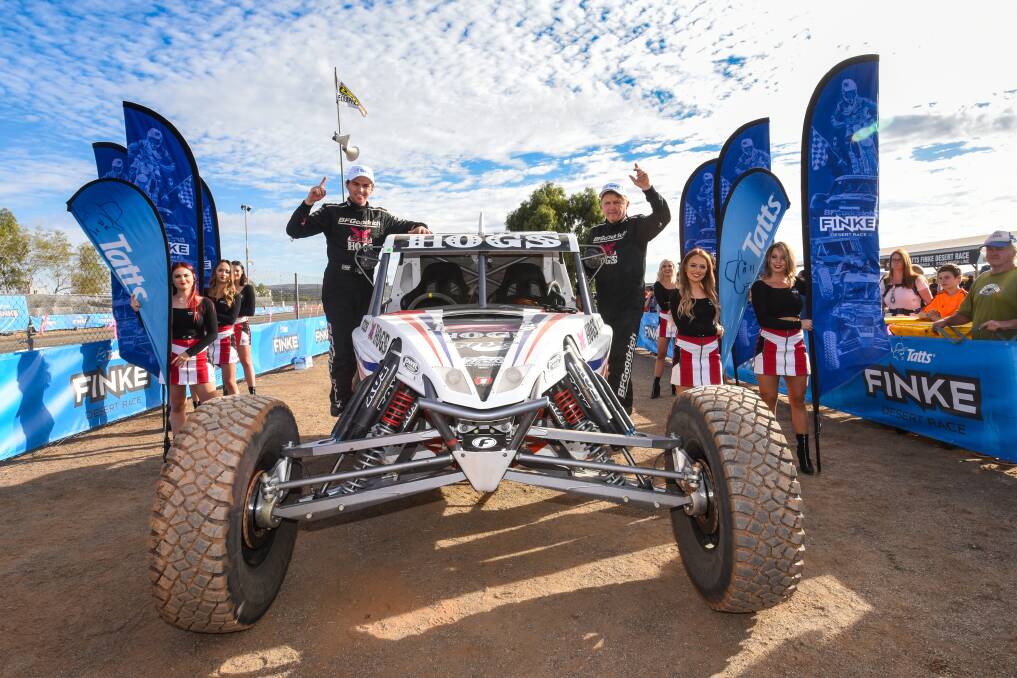 DESERT LEGENDS: Warrnambool’s Shannon and Ian Rentsch celebrate after taking out their sixth Finke Desert Race in the Northern Territory.       