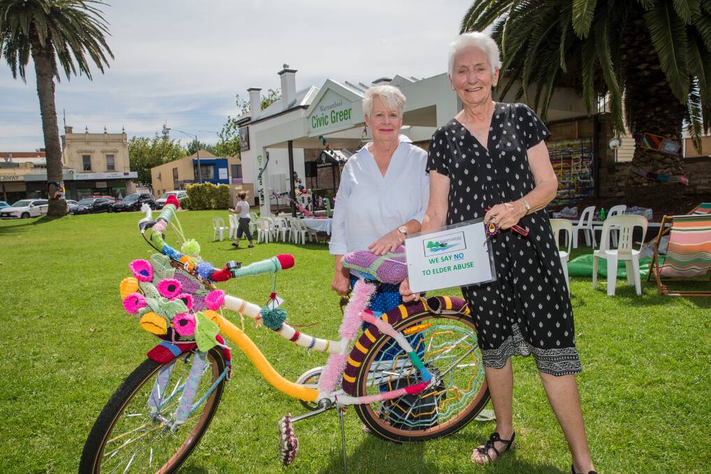 NICE: Warrnambool Bowls Club members Brenda Hawker and Diane Mugavin helped decorate a bike as part of the campaign to prevent elder abuse. Picture: Christine Ansorge