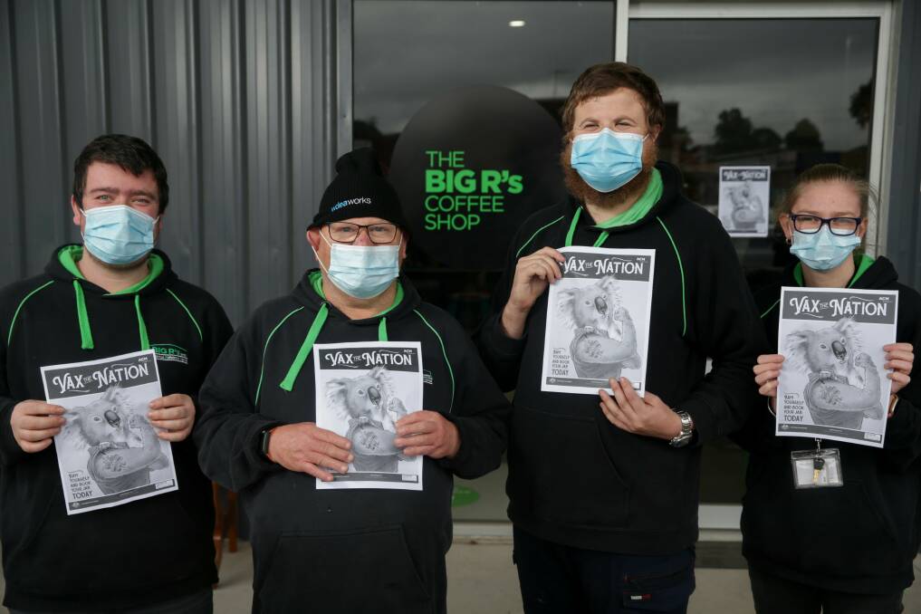DO IT: The BIG R shed workers Dylan Chadderton, Dylan Brunt, Andrew Sheills and Sky Grace with the ACM vaccination campaign posters. Picture: Chris Doheny