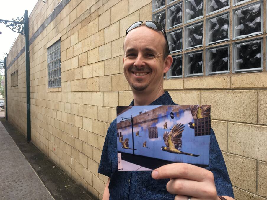 GREAT ART: Warrnambool artist Jimmi Buscombe will transform a wall in the Ozone Walk. He holds a digitally altered image of the work he will complete.
