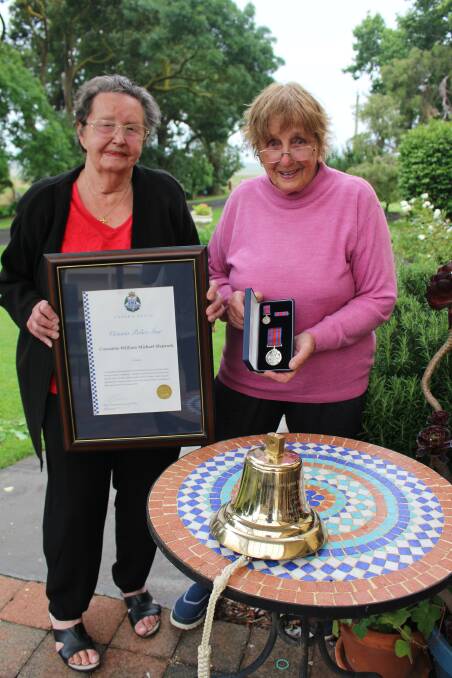 HONOURED: Constable Sharrock's granddaughters Gladys Frost and Win Koenig with the Victoria Police certificate and star medal awarded posthumously in 2017. Picture: Jenny Dwyer