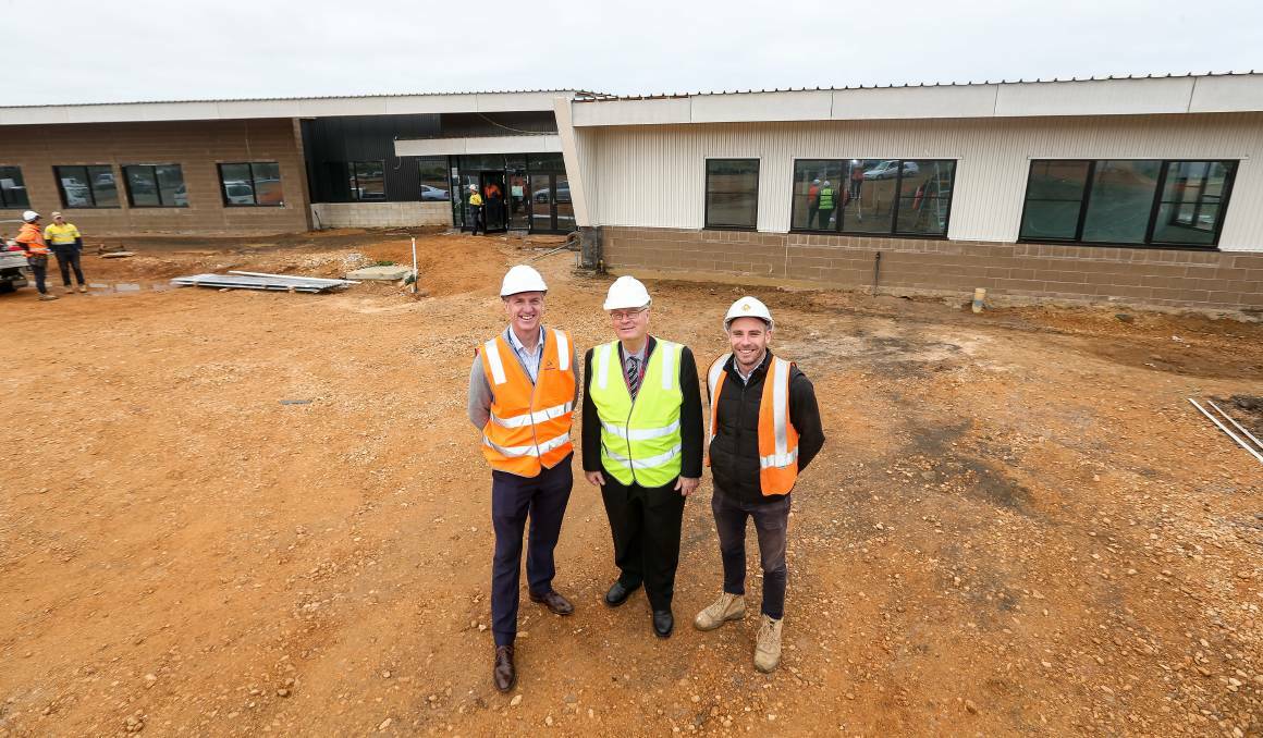 Warrnamboool Special Developmental School school council president Jay Everall, principal Robert Dowell and Fairbrother Construction project manager Aaron Finnigan at the front of the new school. Picture: Christine Ansorge 