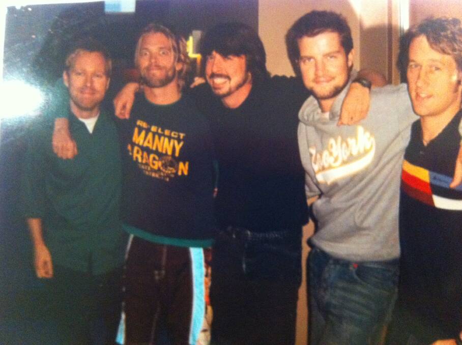 BELOW: Axle Whitehead with the Foo Fighters during his stint as host of Video Hits.