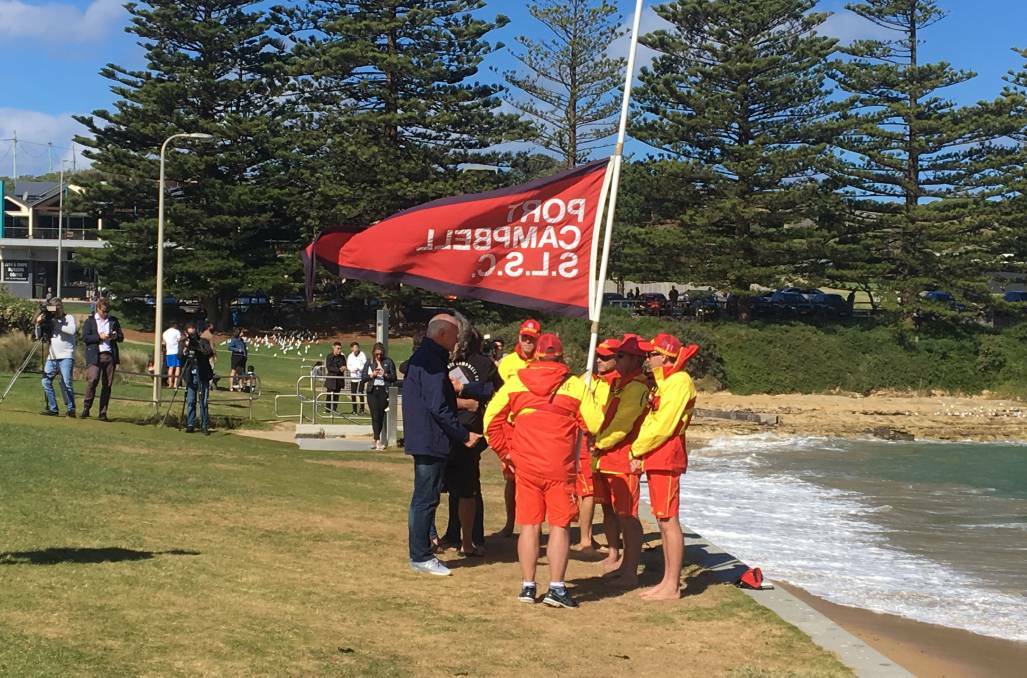 DEVASTATED: Members of the Port Campbell Surf Life Saving Club mourn the loss of their mates on Monday. Picture: Monique Patterson