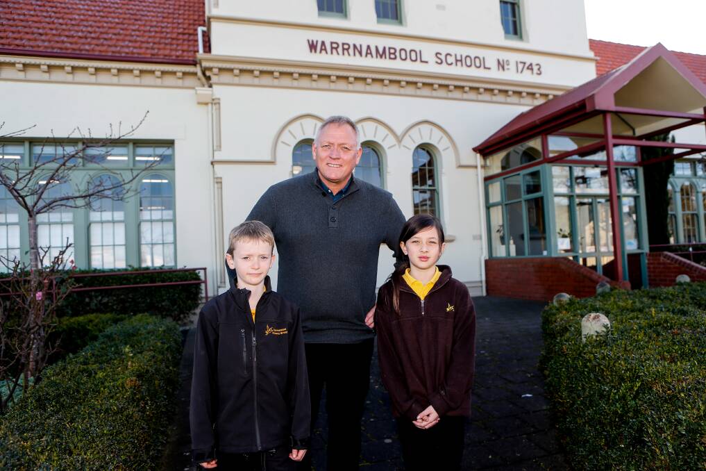 Warrnambool Primary School principal Peter Lee with students Robert Cleverley and Sophia Elford. Picture by Anthony Brady