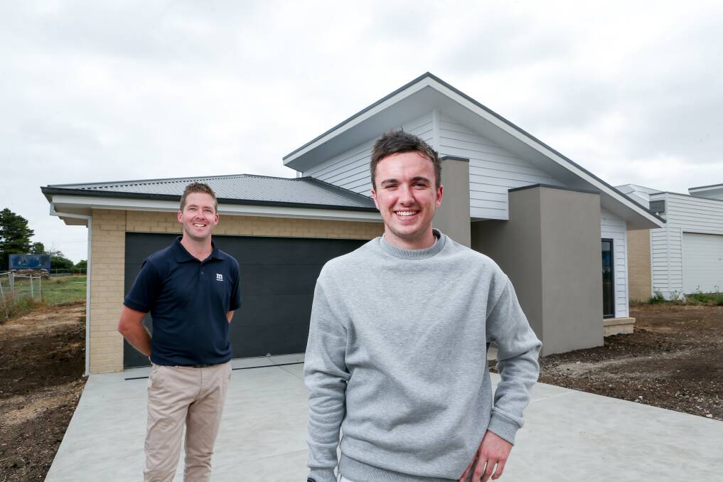DREAM HOME: Allansford's Bronte Baker, 20, receives the keys to his new Warrnambool home after working hard and saving a deposit. Picture: Chris Doheny