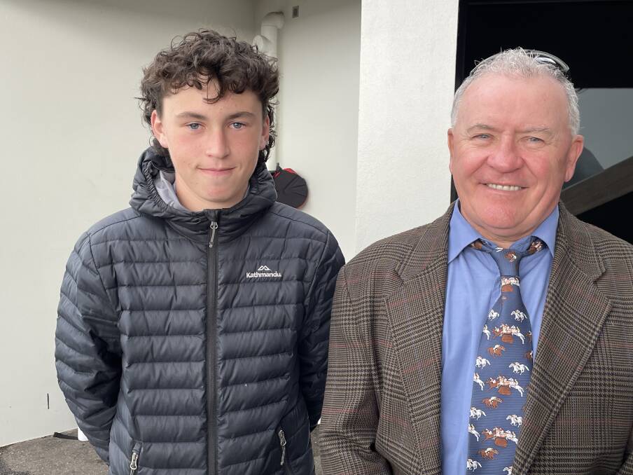 BIRTHDAY BOY: Charlie Brooks celebrated his 14th birthday with his dad John at the May Racing Carnival on Thursday.