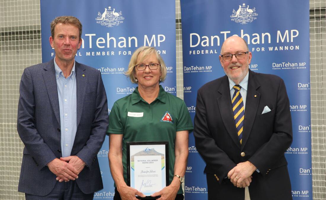 Portland's Jennifer Johns is presented with her award by Dan Tehan and Mick Murphy.