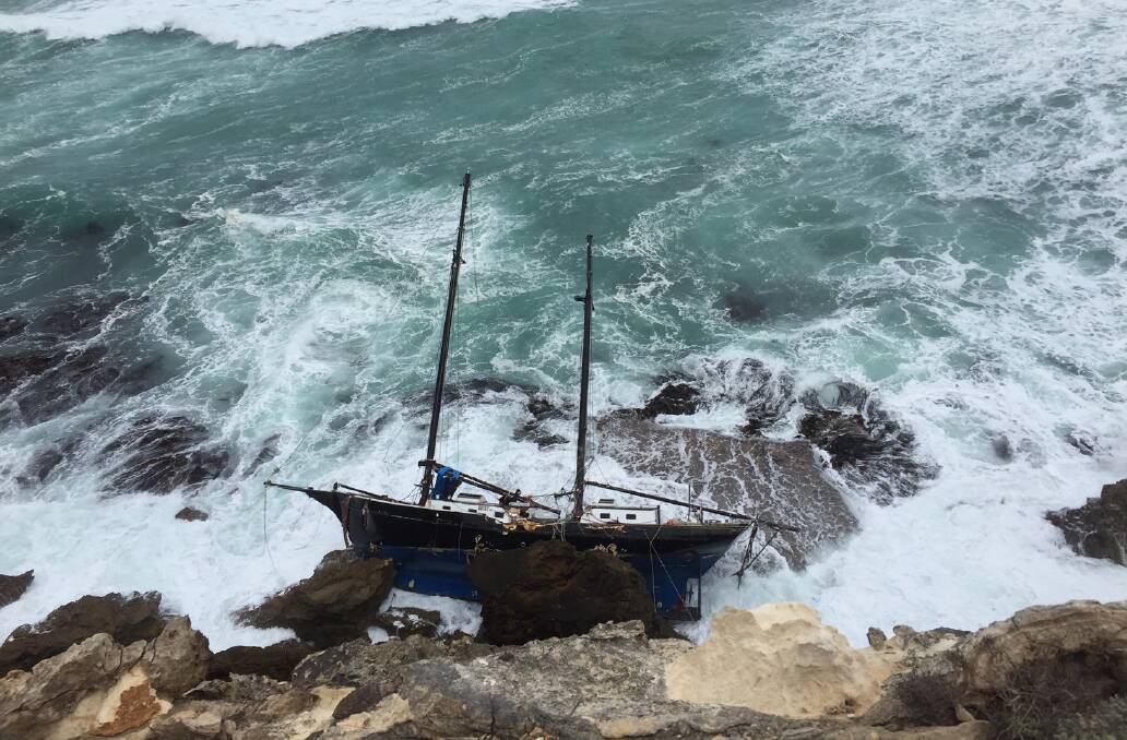The yacht washed up on rocks at Lake Gillear. Picture: Supplied