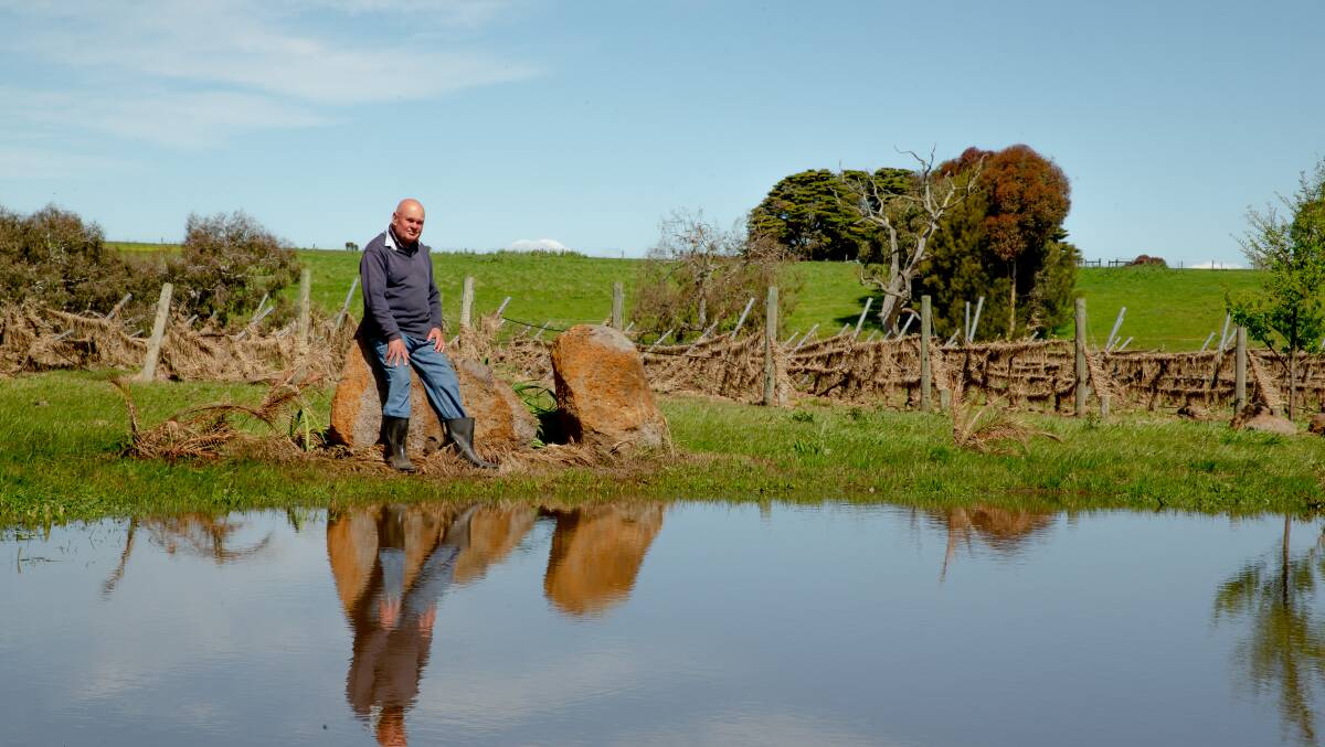 David Farnhill surveys his property, which was inundated with water during the recent floods. Picture by Chris Doheny