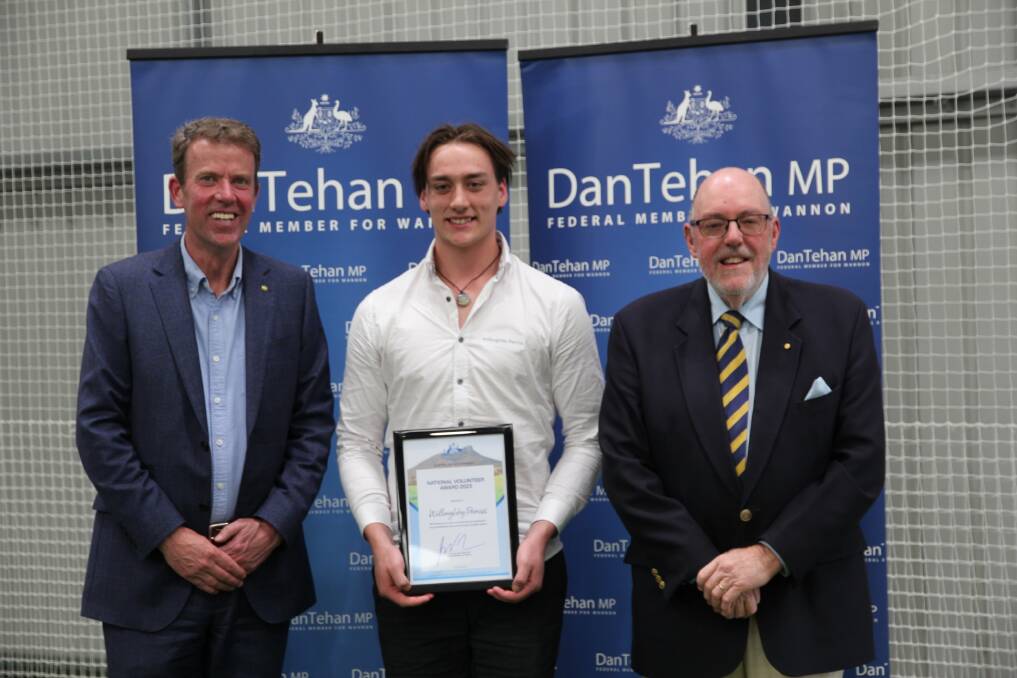 Willoughby Perriss is presented with his award by Dan Tehan and Mick Murphy.