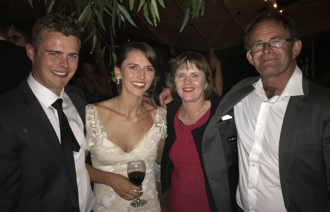 LOVING FAMILY: Sam Fitzgibbon at his sister Sophie's wedding, with parents Jane and Michael, five weeks before he died.