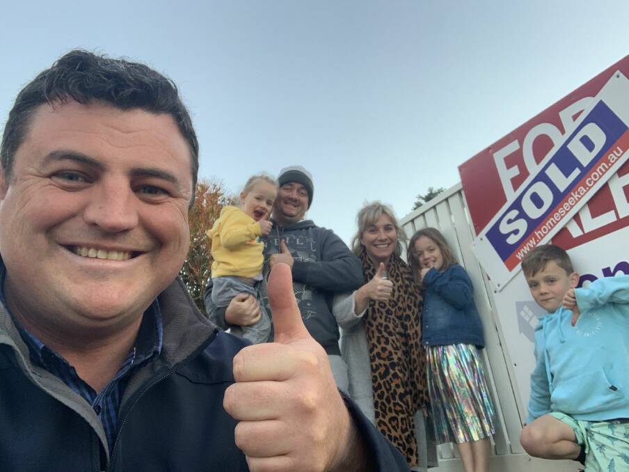 THUMBS UP: Homeseeka Real Estate agent Tim Wells with Christy and Daniel Talbot and their children Daisy, Bonnie and Nash outside their Warrnambool home, which recently sold. Picture: Supplied