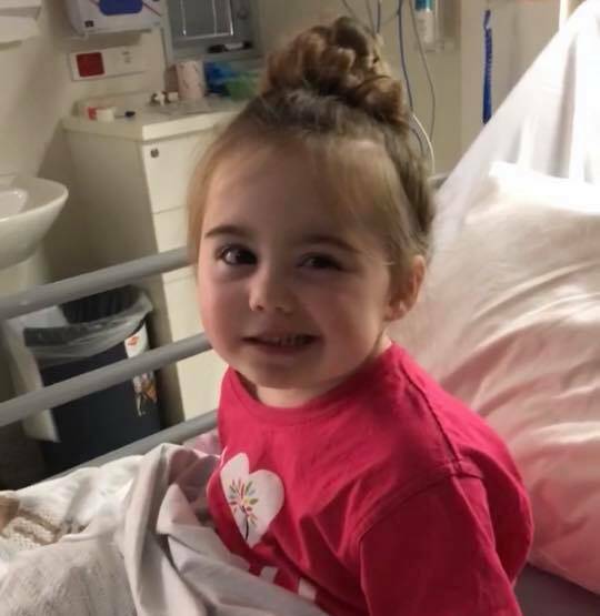 SMILING THROUGH THE PAIN: Lexi Davies will remain in the Royal Children's Hospital for the forseeable future. Picture: Supplied