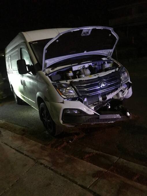 STRUCK: The van sustained substantial damage after it was struck on Sunday morning. The driver of the car which hit it fled the scene but was later tracked down by police.