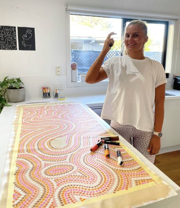 HELPING OTHERS: Bayley Mifsud's Aboriginal art adorns a range of products at Officeworks.