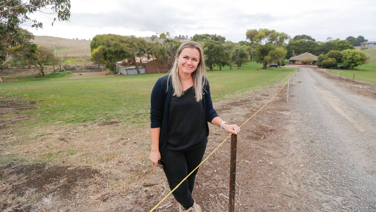 HOUSING PLAN: Midfield Meat's Malerie Janes at the site of a proposed village which will feature cabins and native landscape. Picture: Anthony Brady