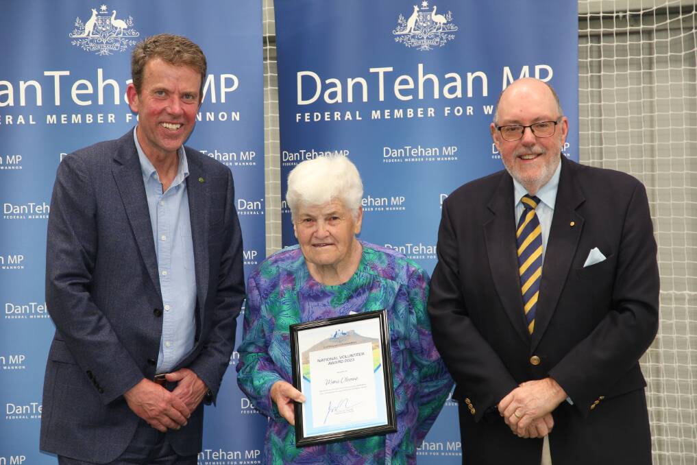 Marie Oborne is presented with her award by Dan Tehan and Mick Murphy.