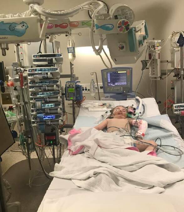 FIGHT FOR LIFE: Lexi Davies was aided by a breathing machine after her strokes. Picture: Supplied