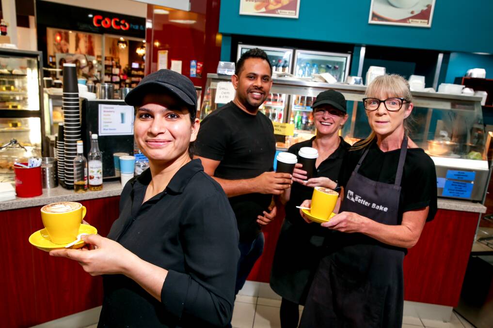PRICE HIKE: Gateway Better Bake owner Ben Singh (back), with staff members Deep Kaur, Julie Bubb and Lenore McKenzie, is doing everything he can to keep the price of a cup of coffee down. Picture: Chris Doheny