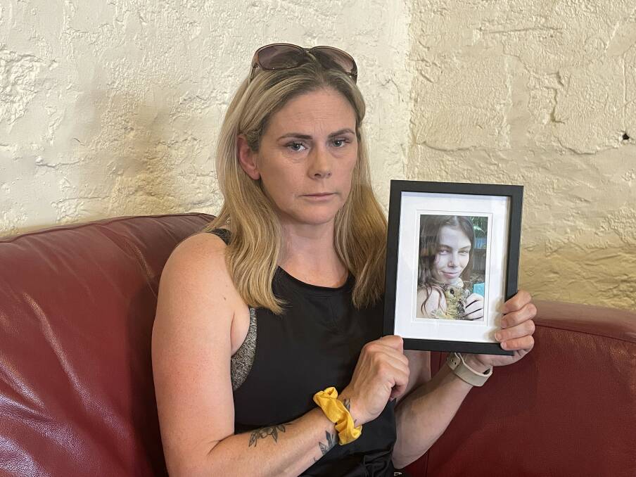 Tash Lambert holds a picture of her daughter Josie Pinheiro.