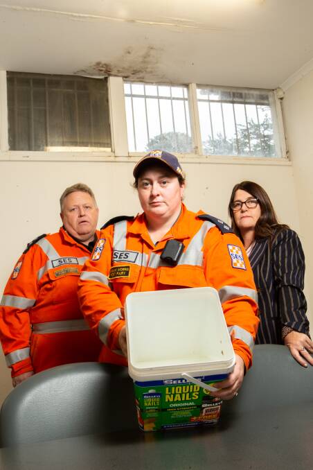 FUNDS NEEDED: Unit controller Stephen McDowell, MP Roma Britnell and Port Fairy SES member Hannah Morris show the leaks and mould in the headquarters. Picyure: Chris Doheny